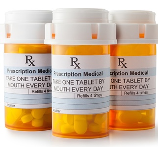 Three prescription medication bottles, representing Medicare Part D prescription drug coverage